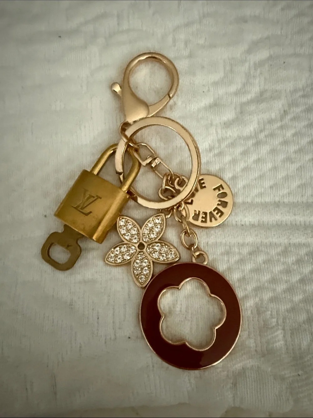 LV lock and key on an unbranded key ring or bag charm
